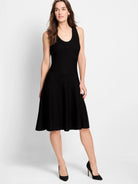 Black, sleeveless, ribbed knit a-line dress.  Falls above the knee.