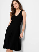 Black ribbed knit sleeveless A-line dress.  Mid-length.