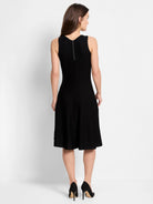 Black, sleeveless, ribbed knit A-line dress.  Hidden back zipper.  Midi length.