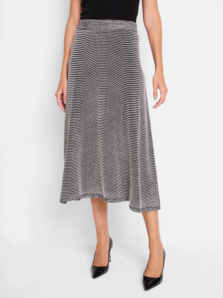 A-line midi skirt in black with white pixel dot zigzag pattern. Marled grey waistband and hem.