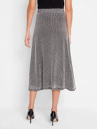 Black and beige knit midi skirt.  A-line shape, textured pattern, metallic waistband.