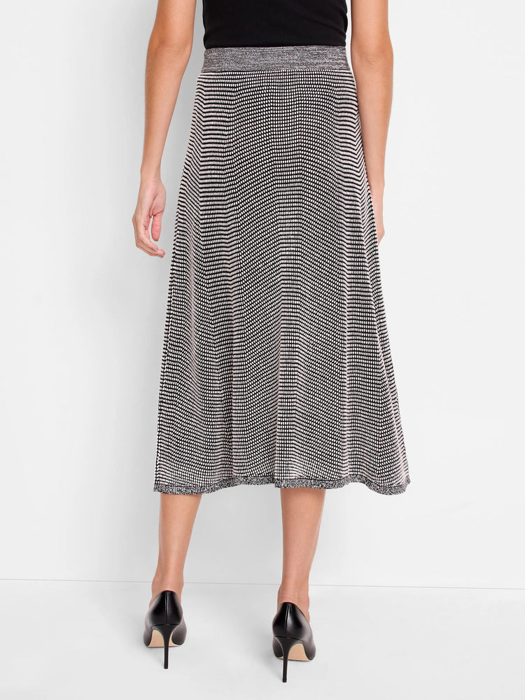 Black & white pixel knit midi skirt, A-line. Light grey marled waistband & raw hem, shown from the back.