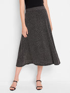 Black midi-length A-line skirt with silver flecks, knit texture.  Slight shimmer.