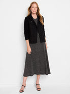 Black midi skirt with a subtle metallic fleck pattern. A-line silhouette.