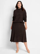 Dark brown midi Pixel Knit Skirt with an A-line shape and speckled texture, worn by a woman.