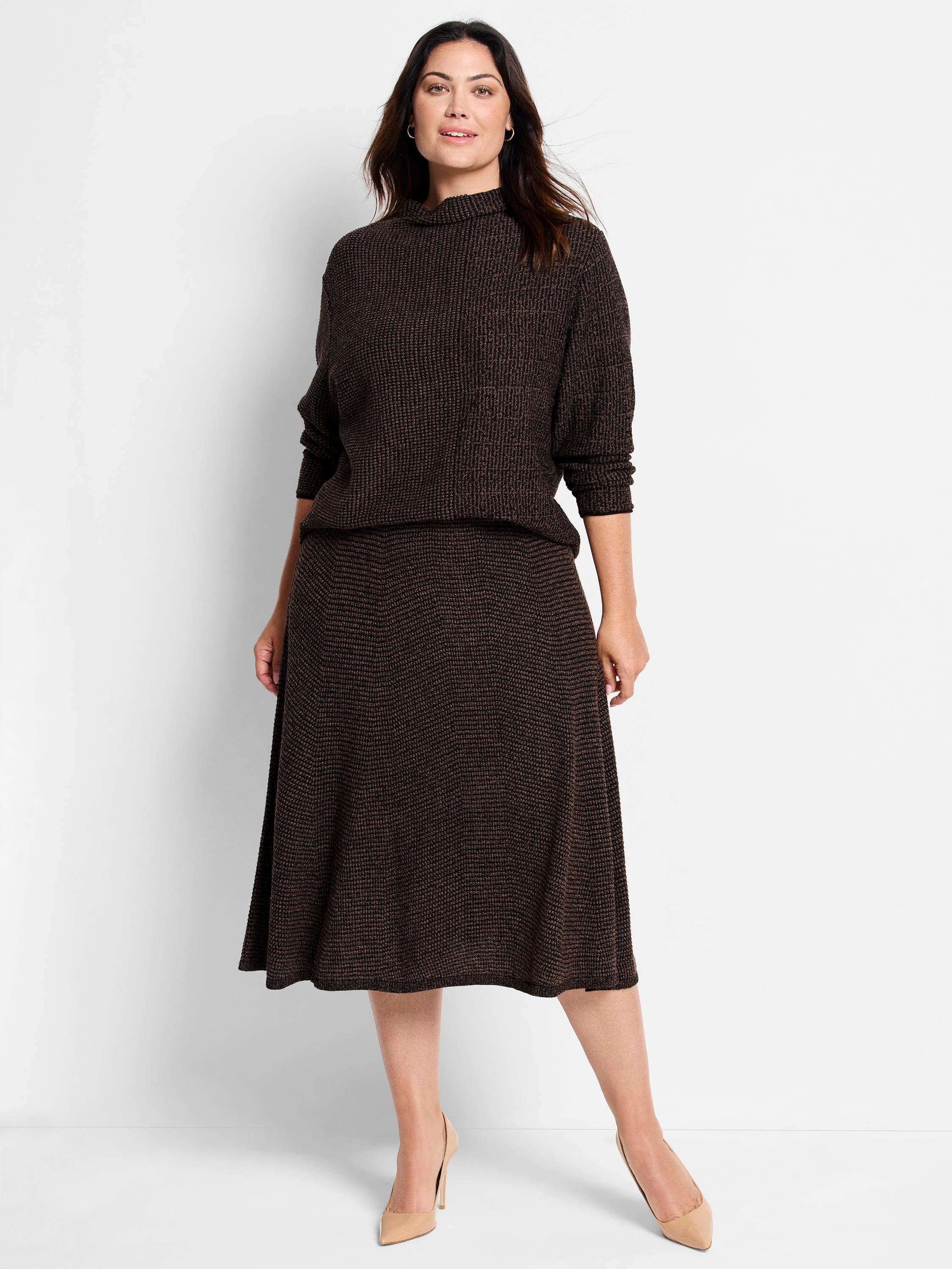 Dark brown midi Pixel Knit Skirt with an A-line shape and speckled texture, worn by a woman.
