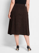 Dark brown pixel knit midi skirt with a subtle brown and black textured pattern. Flared A-line shape.