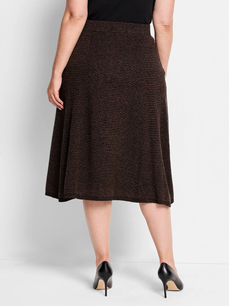 Deep brown pixel knit midi skirt with a textured pattern and a flared, A-line shape, shown from behind.
