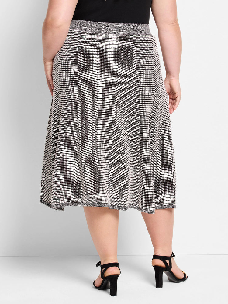 Black and light pixel knit A-line skirt, knee-length, with ribbed waist and hem.