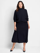 Dark navy A-line midi knit skirt with a subtle raised "pixel" texture.