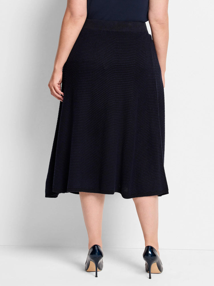Dark navy A-line knit skirt with a pixel texture, shown from behind.