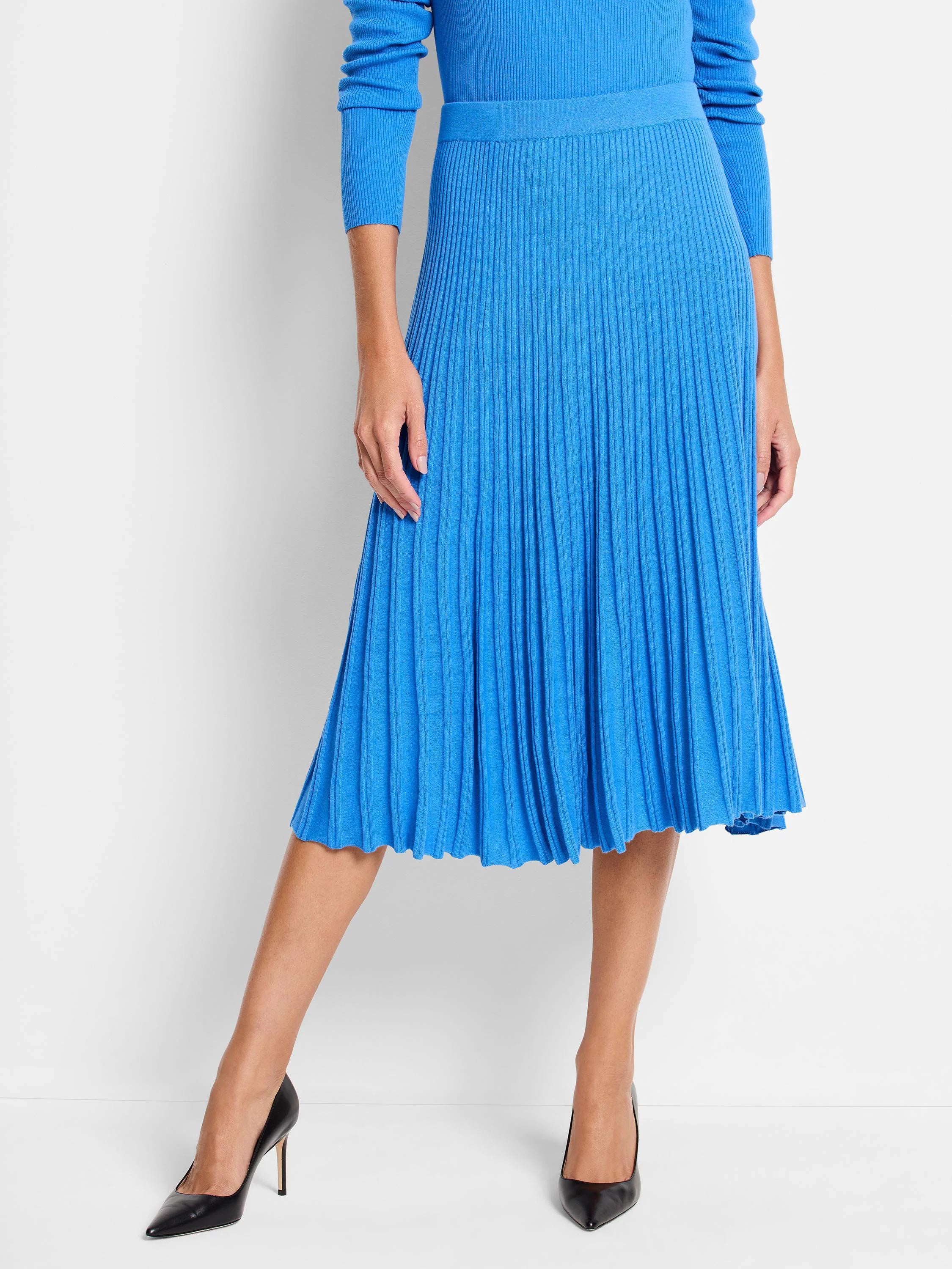 Vibrant blue ribbed knit midi skirt, A-line shape with distinct vertical ribs.
