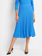 Bright blue ribbed sweater skirt, pleated and midi-length.