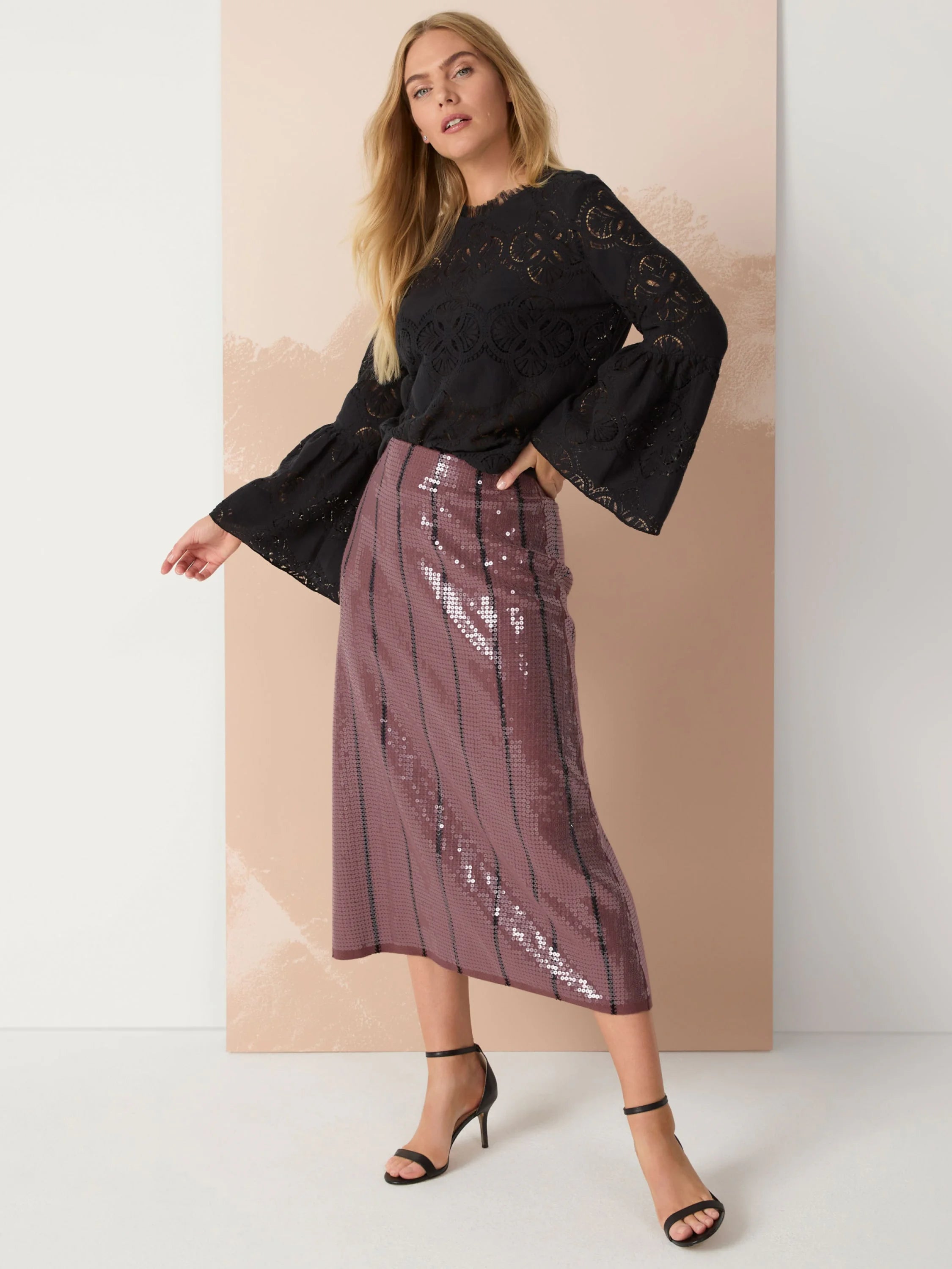 Mauve sequined midi skirt with thin black stripes.