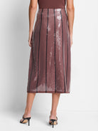 Mauve sequin midi skirt with thin black vertical stripes.