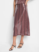 Mauve sequin midi skirt with vertical black stripes.