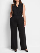 Black wide-leg pants;  high-waisted,  straight legs, pockets. Model wears black top.