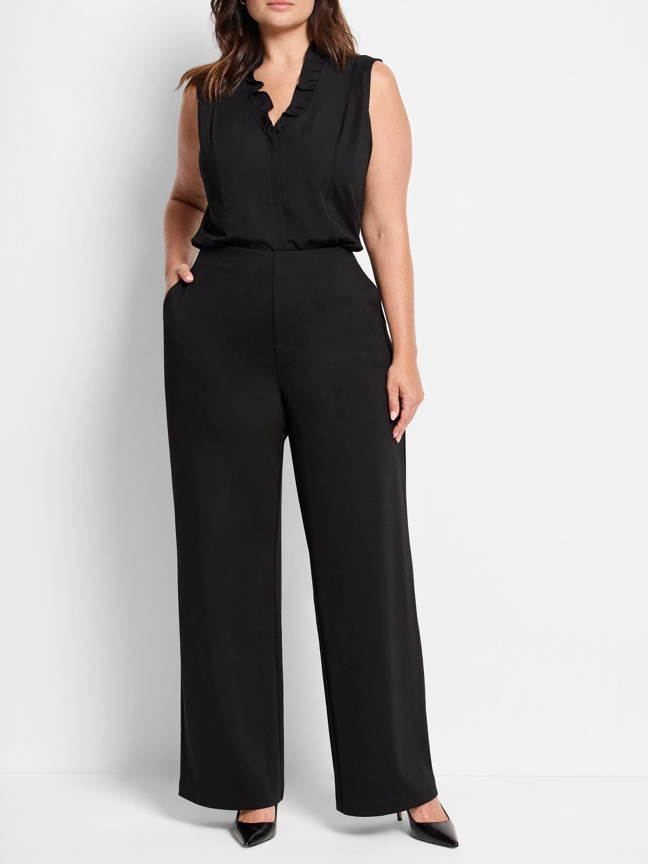 Black wide-leg pants;  high-waisted,  straight legs, pockets. Model wears black top.