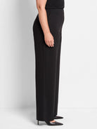 Black wide-leg pants shown on a model.  The pants are a straight, long silhouette.