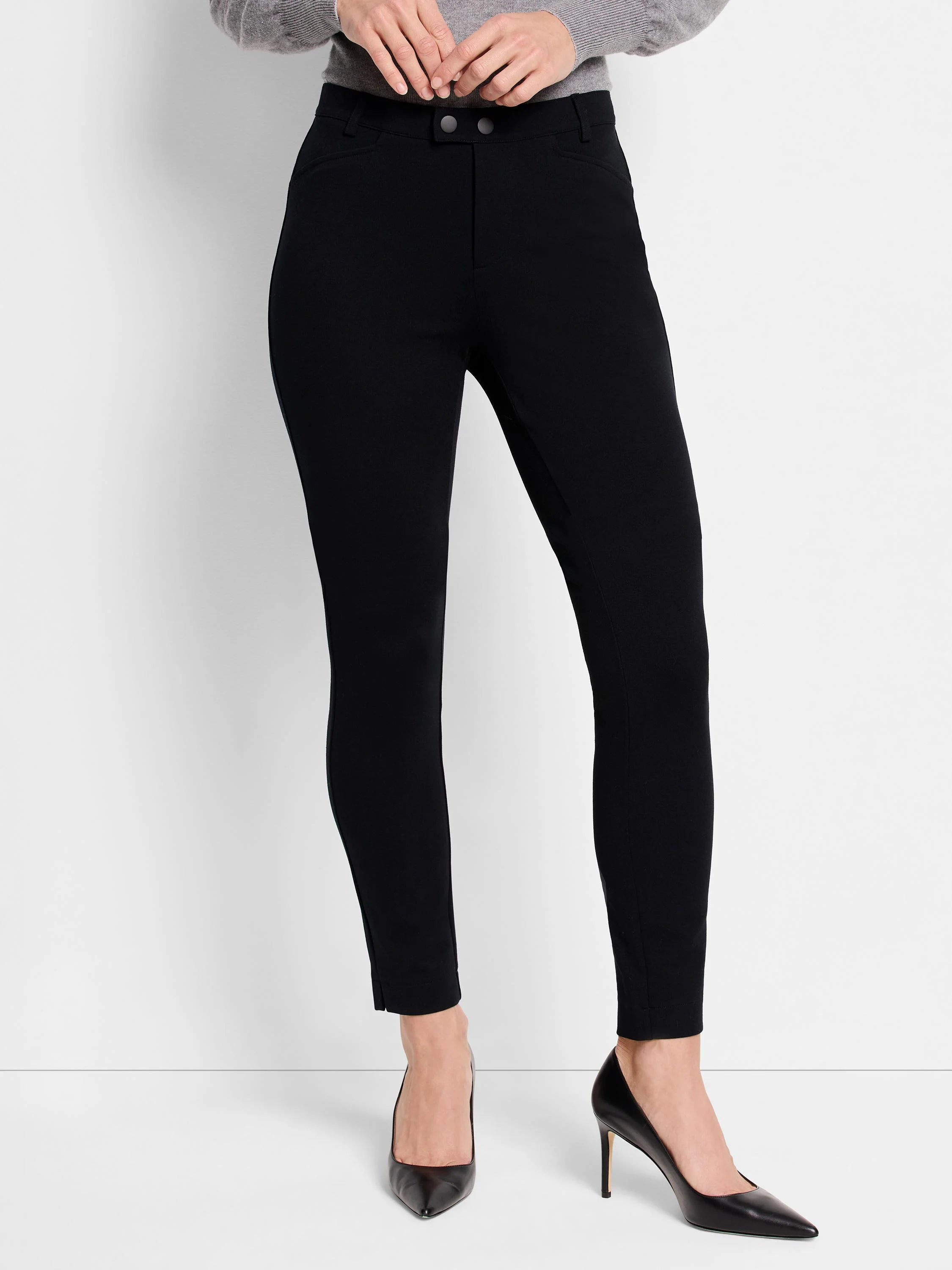 Black knit riding pants; slim fit, cropped length, two button closure.