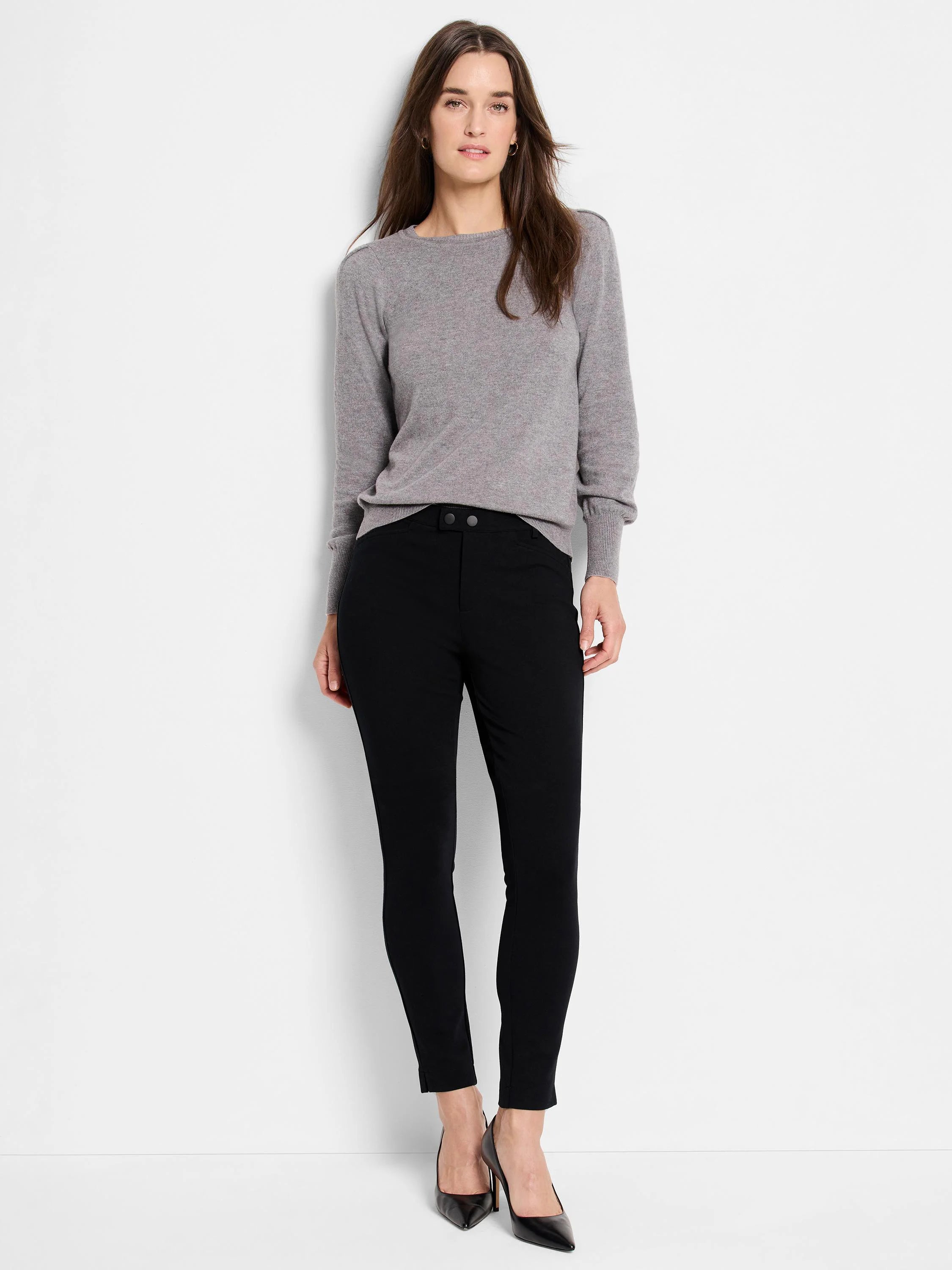 Black knit riding pants; model wears gray sweater.