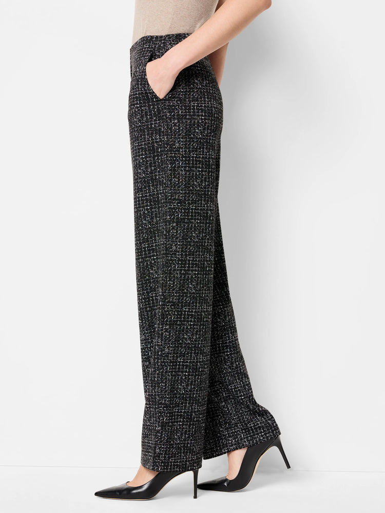 Black wide-leg pants with a white dot grid pattern.
