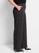 Black wide-leg pants with a small white dot grid pattern.  High waist, side pockets.