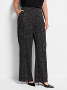 Black wide-leg pants with a small white and grey grid pattern.  High waist.