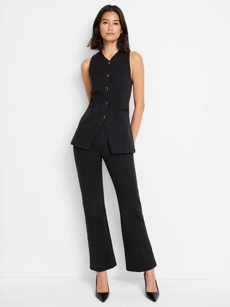 Black sleeveless vest with buttons, slightly longer back hem.  Features a mandarin collar and front pockets.