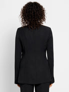 Black blazer, long sleeves, back view.  Seams visible at the back.