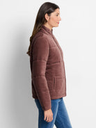 Mauve velvet puffer jacket.  Quilted design, zip front.