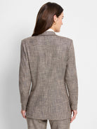 Brown tweed blazer, rear view.  Features a subtle beige and dark brown speckled pattern.  Long sleeves, notched collar.