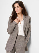 Gray tweed blazer with subtle black flecks.  Single-breasted, notched lapel, and pockets.