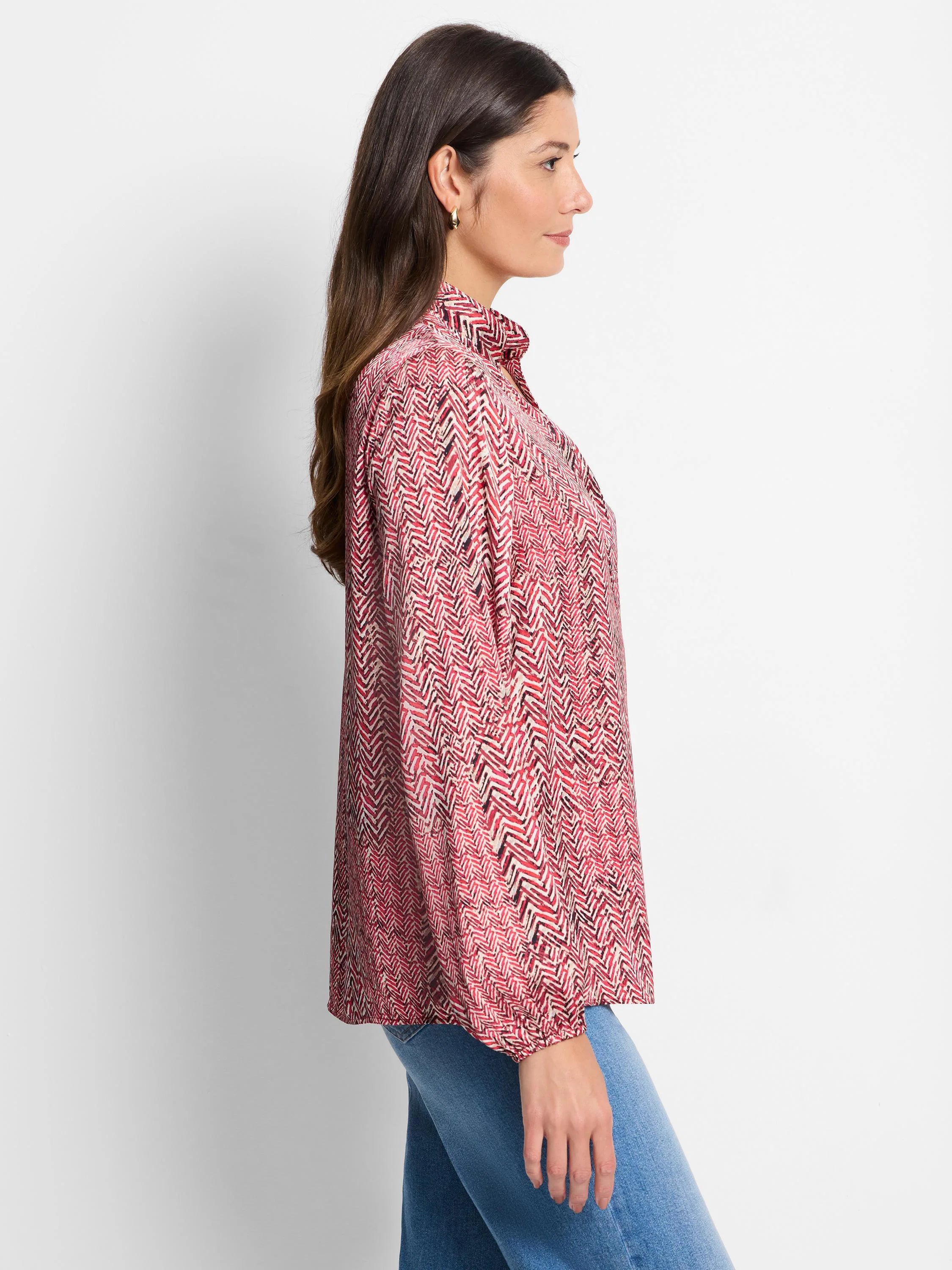 Red and cream herringbone patterned long-sleeve blouse.  Collared, loose fit.