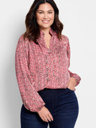 Red and cream herringbone patterned blouse with long sleeves and a v-neck.  Elastic cuffs.