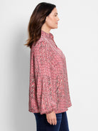 Red and cream herringbone patterned shirt; long sleeves, collared.