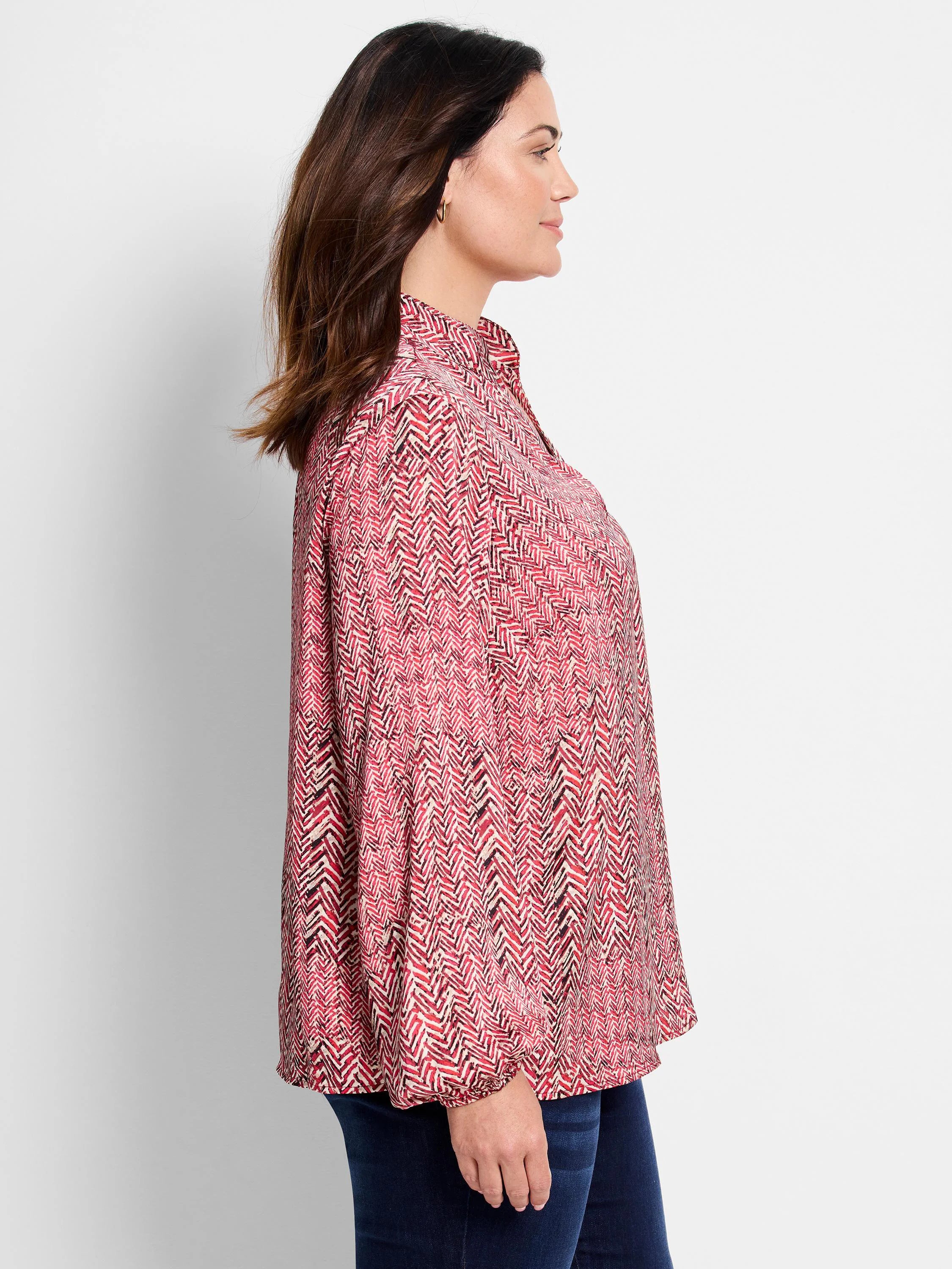 Red and cream herringbone patterned shirt; long sleeves, collared.