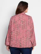Red and cream herringbone patterned long-sleeve blouse with balloon sleeves and high neck.