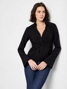Black, long-sleeve shirt; twist front detail; collared neckline; slightly flared cuffs.