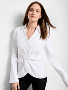 White long-sleeve shirt; V-neck, twist front detail,  cuffs.