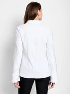 White long-sleeve shirt, shown from the back.  Bell sleeves and collared neckline.