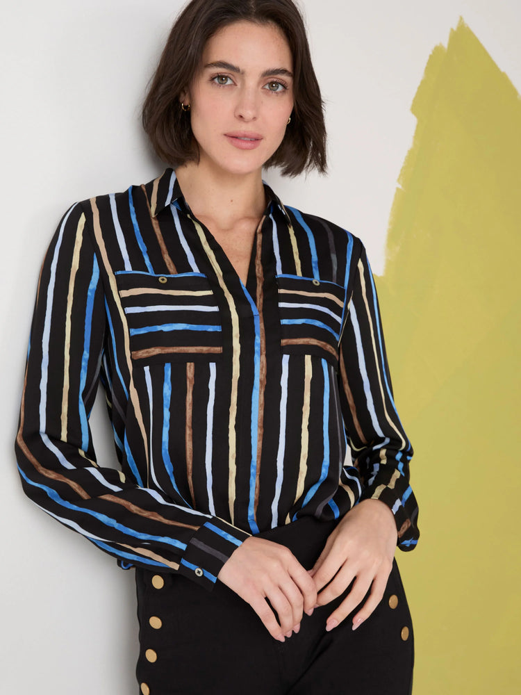 Black shirt with vertical blue, brown, and beige stripes.  Long sleeves, collared, and two chest pockets.