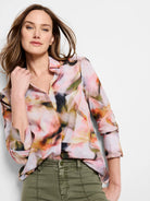 Smoky Petals shirt; long-sleeved button-down.  Abstract print in pink, orange, green, and dark brown hues on a light...