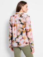 Smoky Petals shirt; long-sleeved collared button-down.  Abstract print in pale pink, muted greens, oranges, and dark browns.