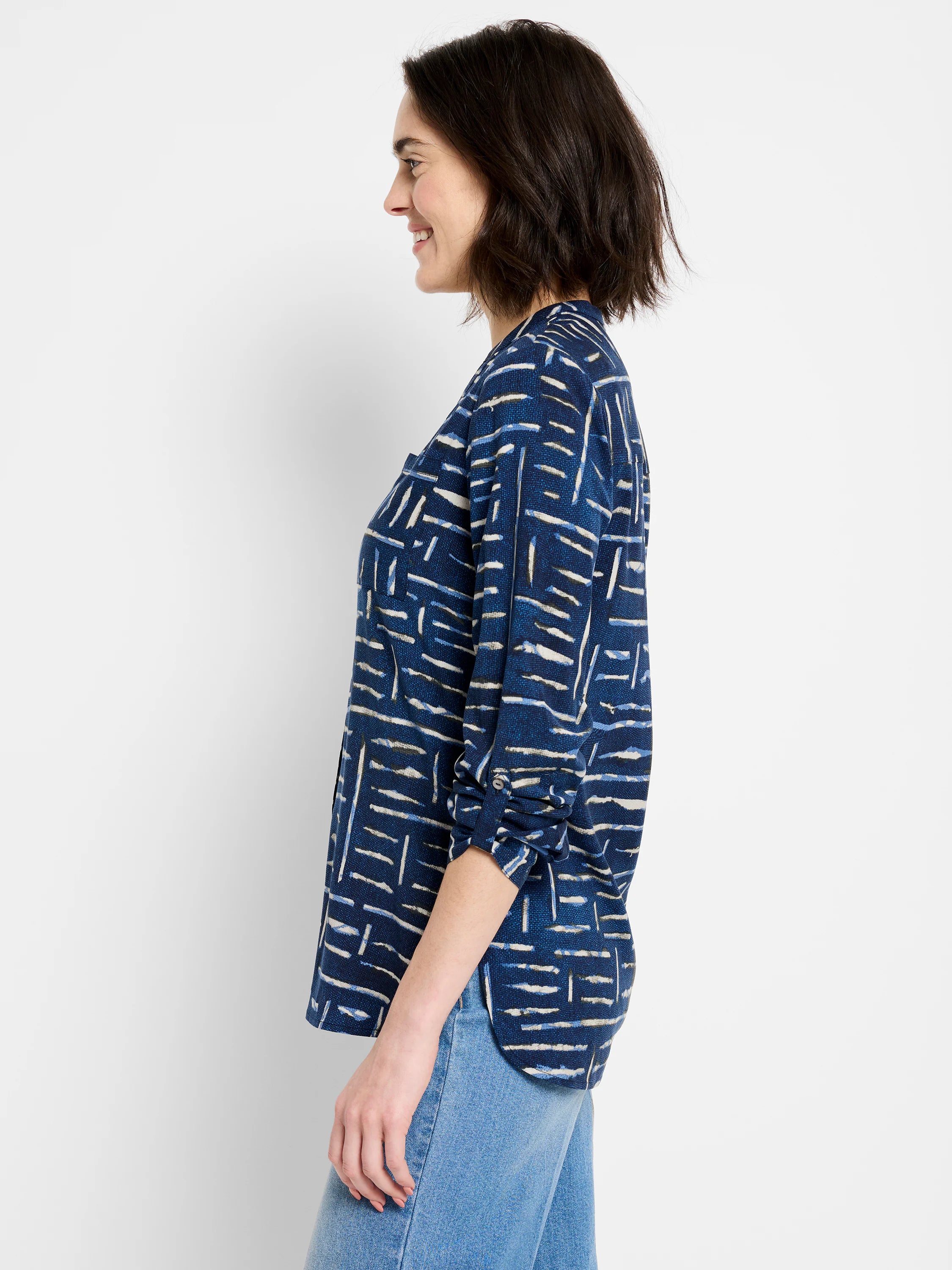 Indigo shirt with a pattern of lighter blue and off-white horizontal dashes. Three-quarter sleeves and a chest pocket.