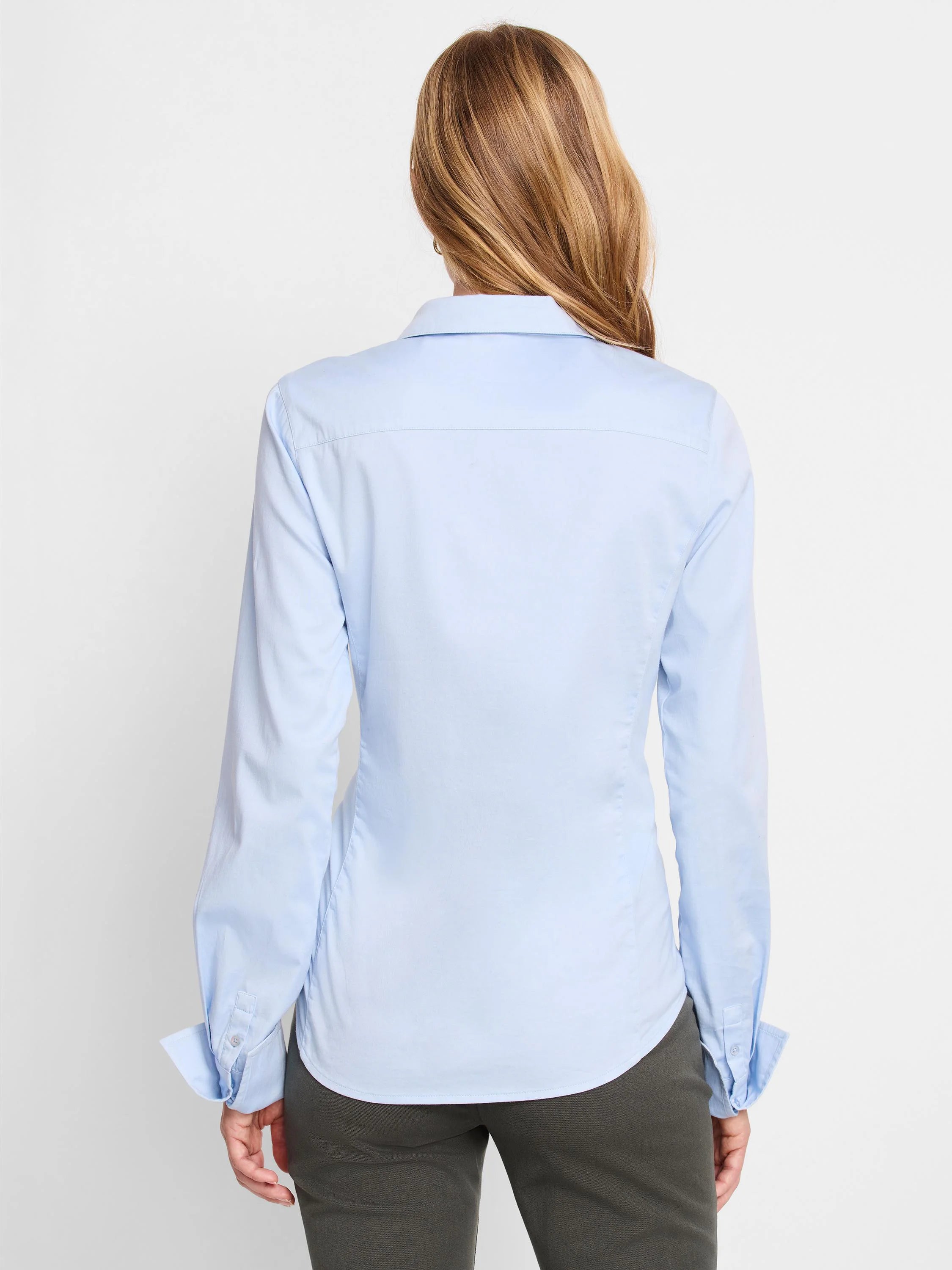 Light blue, long-sleeve button-cuff shirt; shown from the back.
