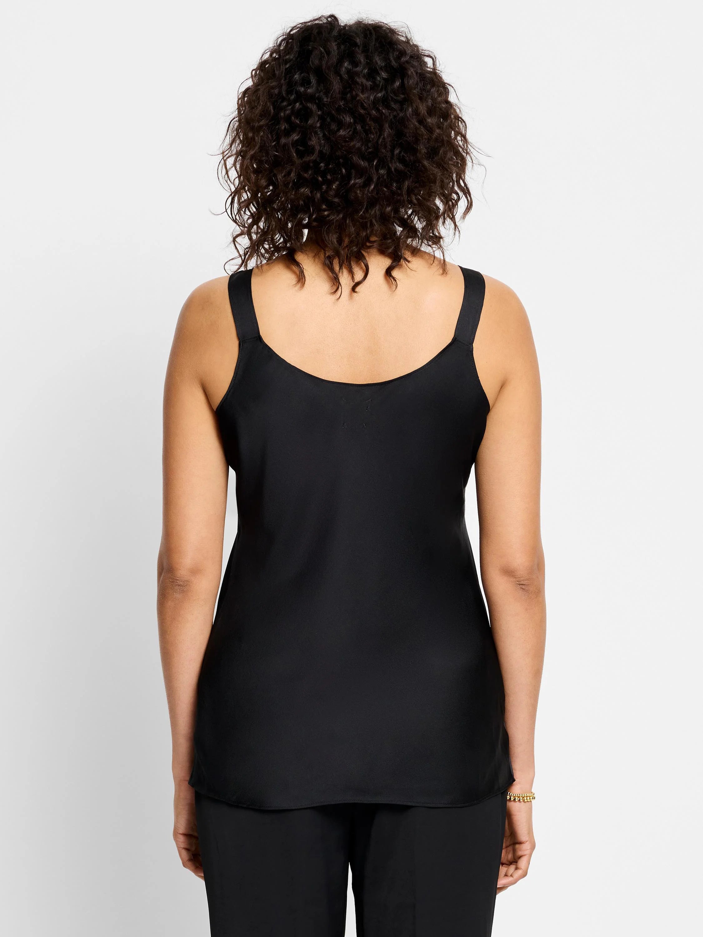 Black crepe cami, shown from the back.  The cami has thin straps.