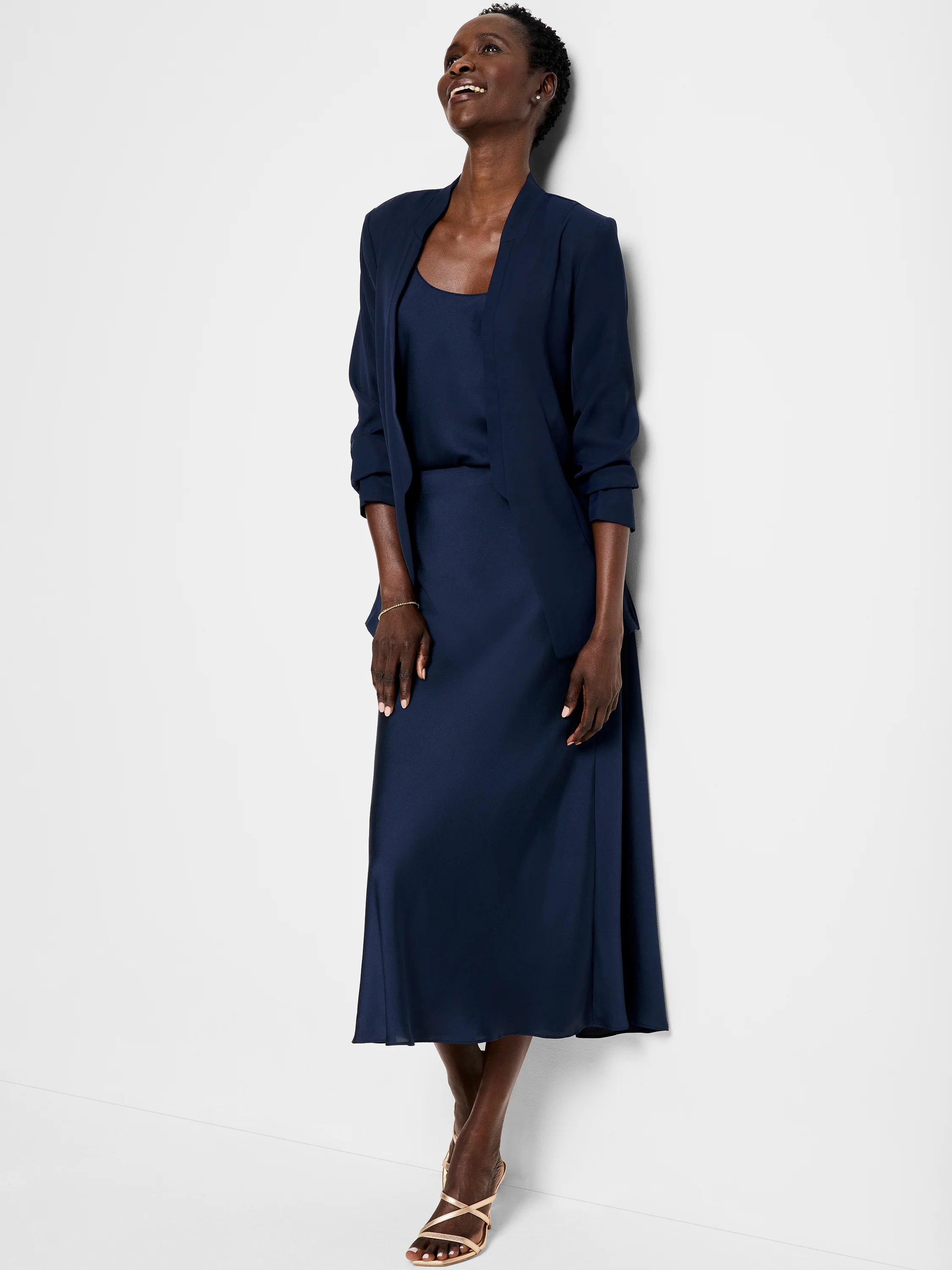 Navy blue crepe cami and midi skirt.  A-line skirt.  Model wears open navy blazer.