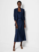 Navy blue crepe cami and midi skirt.  Model wears a navy blazer.