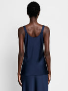 Navy blue crepe cami; sleeveless, scoop neck.  Shown from the back.